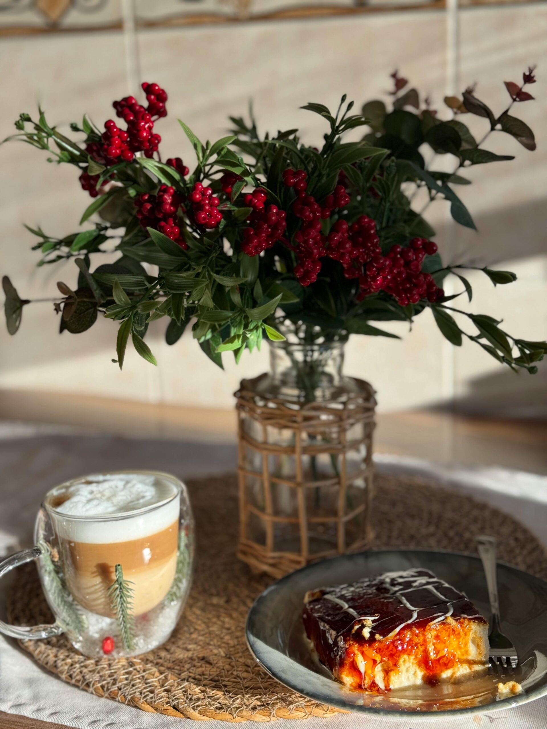 Aromatic coffee and pastry set with a vibrant floral arrangement, perfect for a cozy morning vibe.
